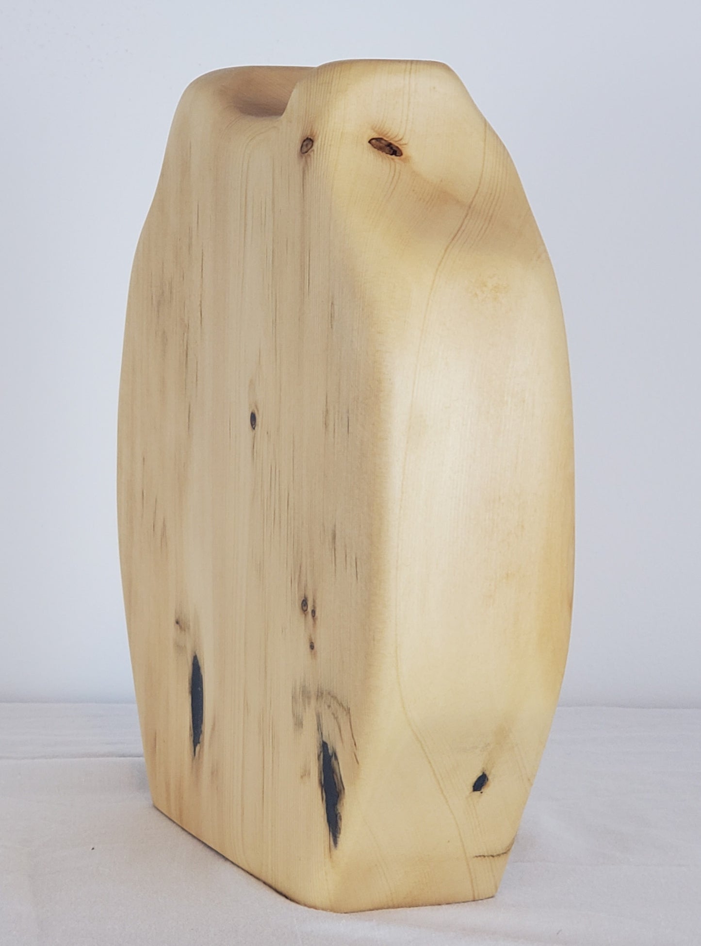 Wooden vase with natural grain and texture on a white background