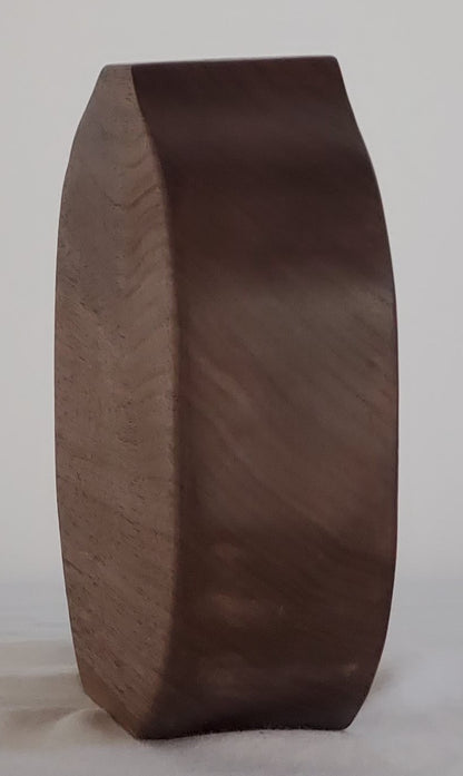 Brown wooden bud vase on a white background