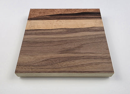 Wooden art with a wavy pattern on a plywood backing. Jennifer Mourato Art Collection