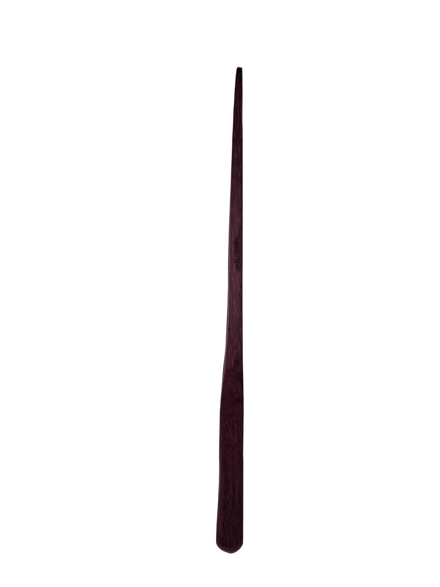 Long, thin, dark purple side profile of a spurtle on a light gray background