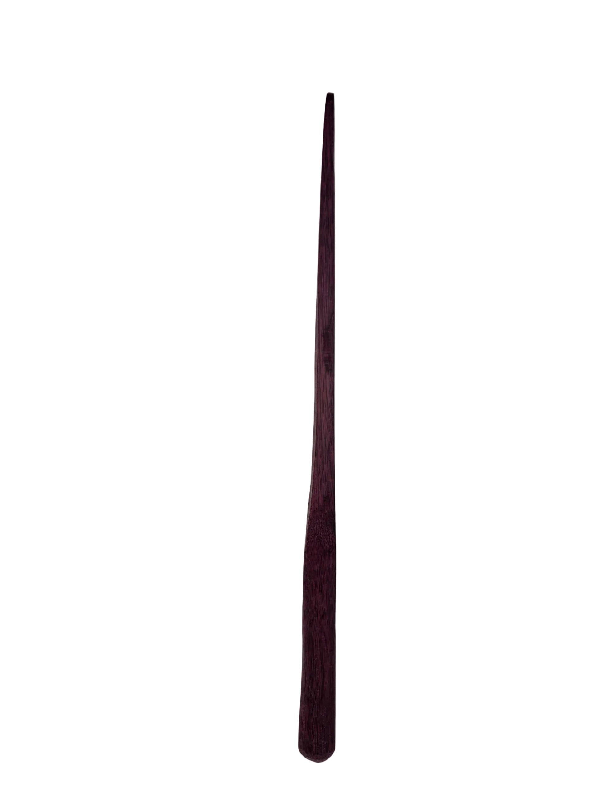 Long, thin, dark purple side profile of a spurtle on a light gray background