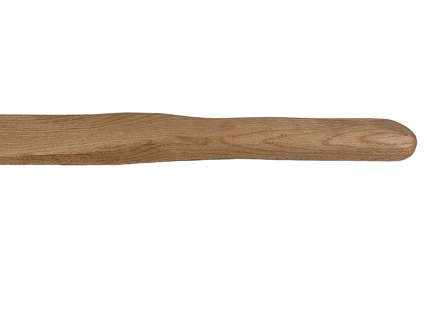 Wooden spurtle on a light gray surface