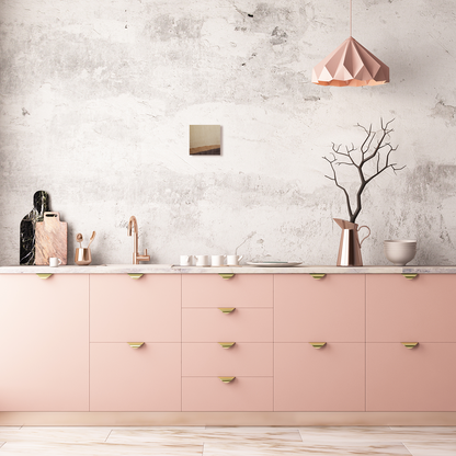 Wooden artwork on wall above pink lower kitchen cabinets. Jennifer Mourato Art Collection